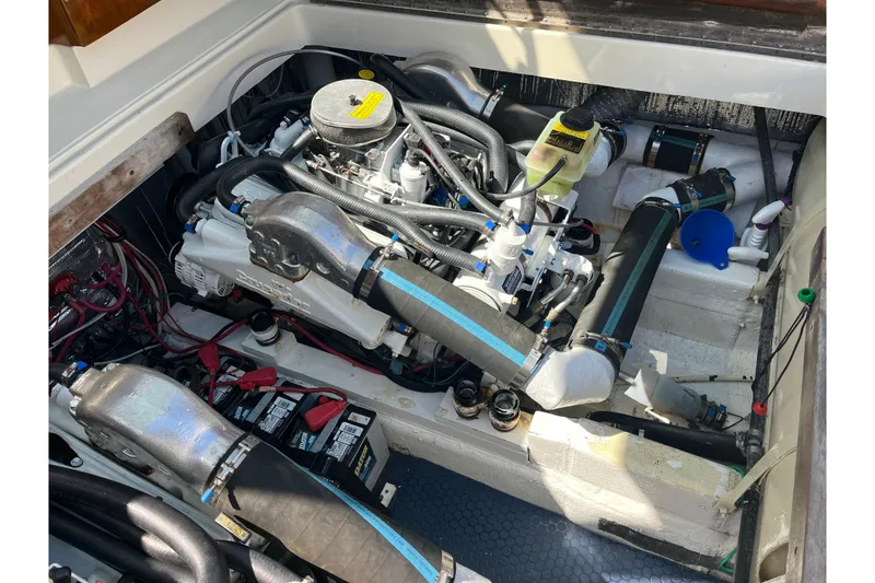 Slide: The Image of Engine compartment of a 1966 Chris-Craft 27 Commander boat, showcasing detailed mechanical components. - 32