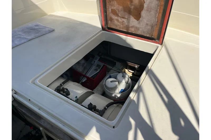 Slide: The Image of Open engine compartment of 1966 Chris-Craft 27 Commander boat, showing interior components. - 33