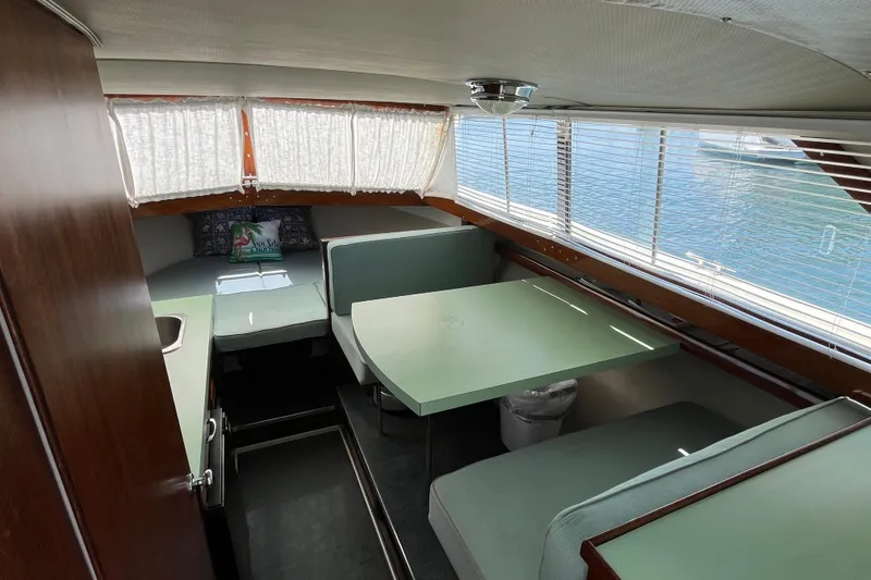 Slide: The Image of Interior of a 1966 Chris-Craft 27 Commander boat with vintage seating and table. - 34