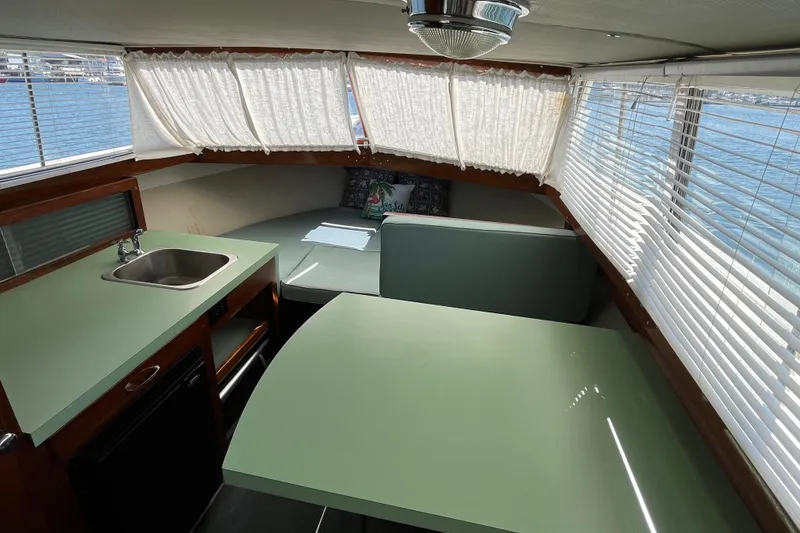 Slide: The Image of Interior of 1966 Chris-Craft 27 Commander with kitchenette and seating area. - 35