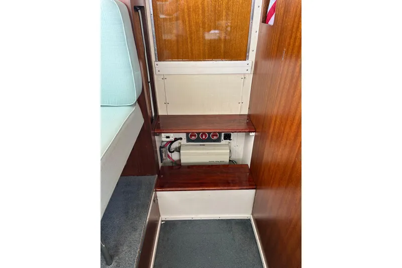 Slide: The Image of Interior of 1966 Chris-Craft 27 Commander showing wooden steps and electrical panel. - 43