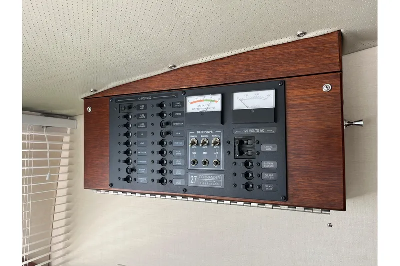 Slide: The Image of Electrical panel of a 1966 Chris-Craft 27 Commander boat, featuring gauges and switches. - 45