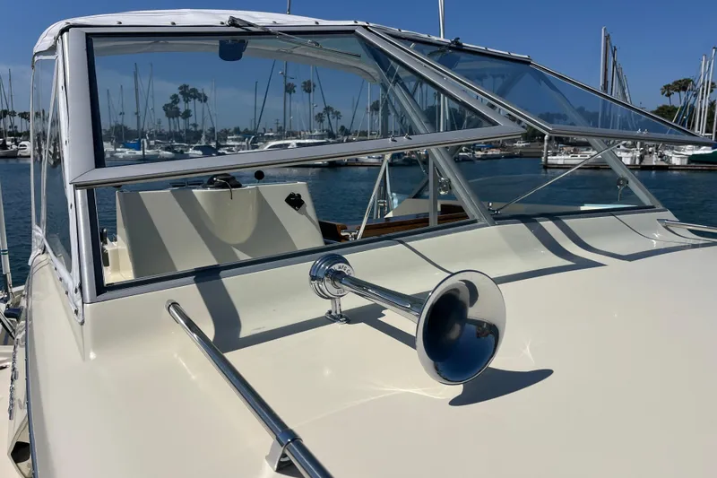 Slide: The Image of 1966 Chris-Craft 27 Commander boat with chrome horn, docked in marina. - 9