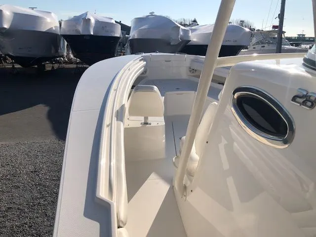 Slide: The Image of 2019 Regulator 28 Forward Seating boat in harbor. - 19