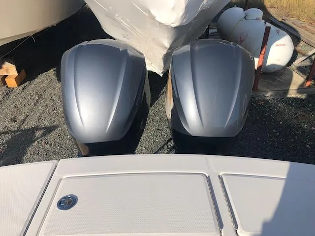Slide: The Image of Two outboard motors of a 2019 Regulator 28 boat. - 21