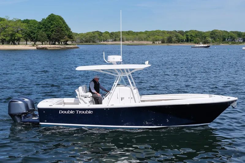 Slide: The Image of 2019 Regulator 28 Forward Seating boat on water, named "Double Trouble." - 9
