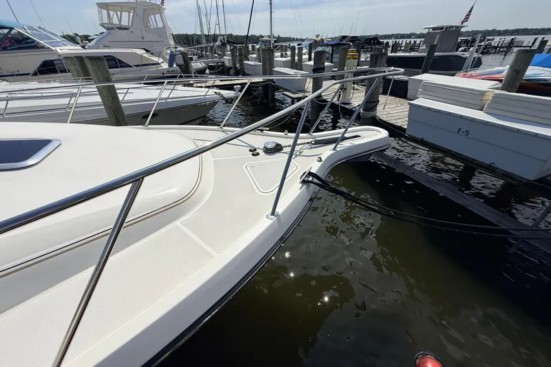 Slide: The Image of 1995 Tiara Yachts 4000 Express docked at marina, showcasing sleek bow design. - 15