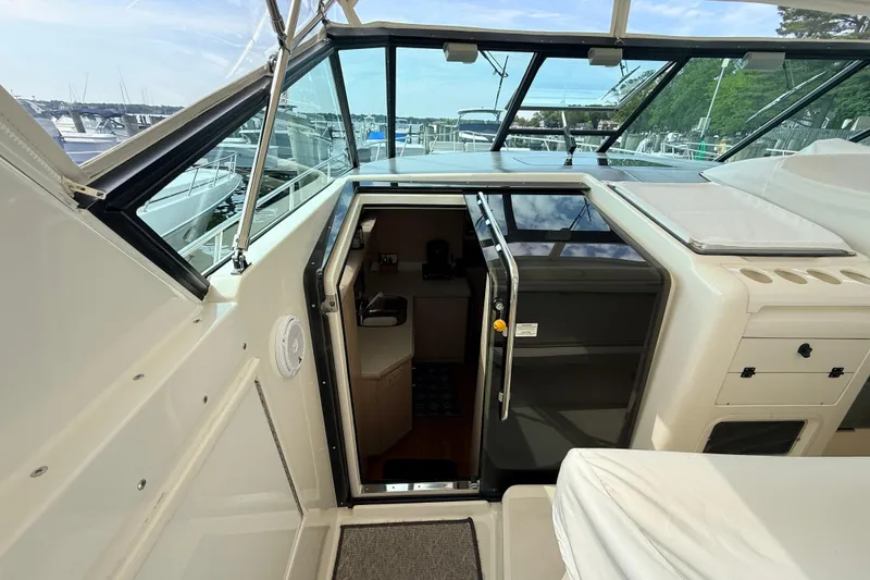 Slide: The Image of 1995 Tiara Yachts 4000 Express interior view with open cabin door. - 18