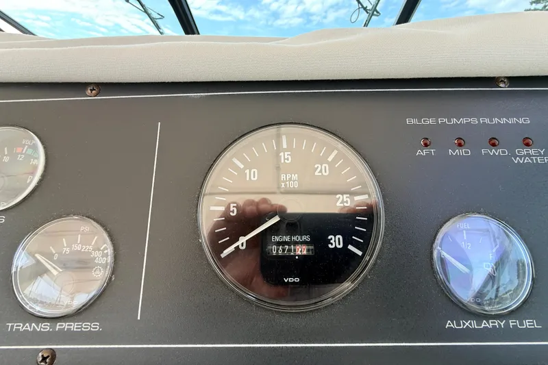 Slide: The Image of Dashboard of a 1995 Tiara Yachts 4000 Express showing RPM and engine hours. - 19