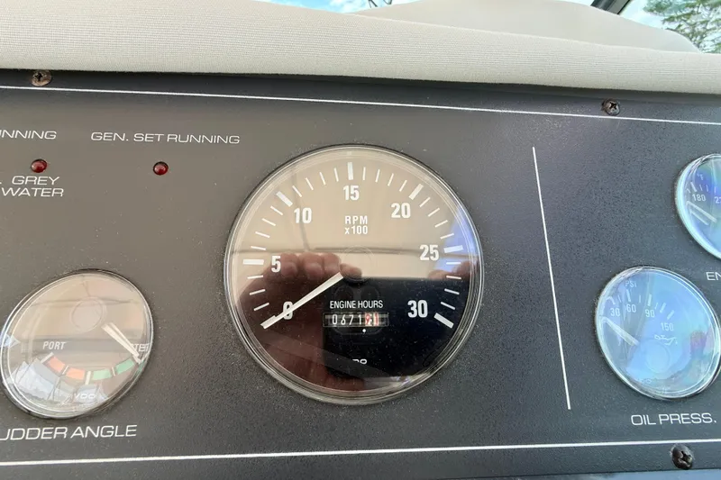 Slide: The Image of Dashboard of a 1995 Tiara Yachts 4000 Express showing RPM and engine hours. - 20