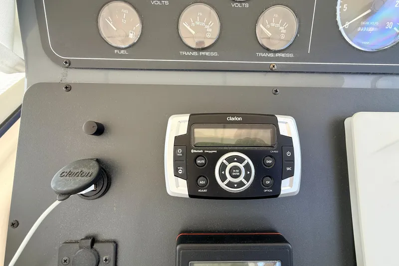 Slide: The Image of Dashboard of a 1995 Tiara Yachts 4000 Express with Clarion audio system. - 23