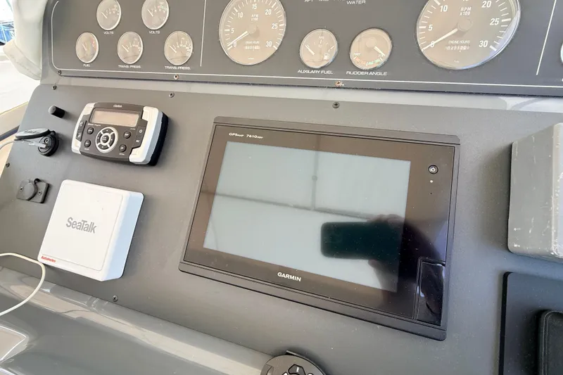 Slide: The Image of 1995 Tiara Yachts 4000 Express dashboard with Garmin GPS and SeaTalk system. - 24