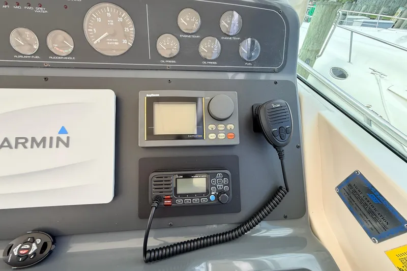Slide: The Image of Dashboard of a 1995 Tiara Yachts 4000 Express with navigation and communication equipment. - 25