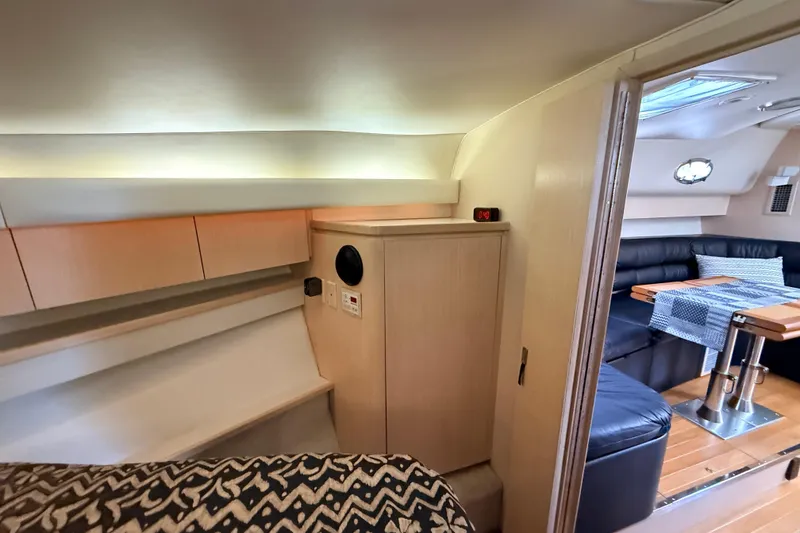 Slide: The Image of 1995 Tiara Yachts 4000 Express interior with modern furnishings and cozy seating area. - 36