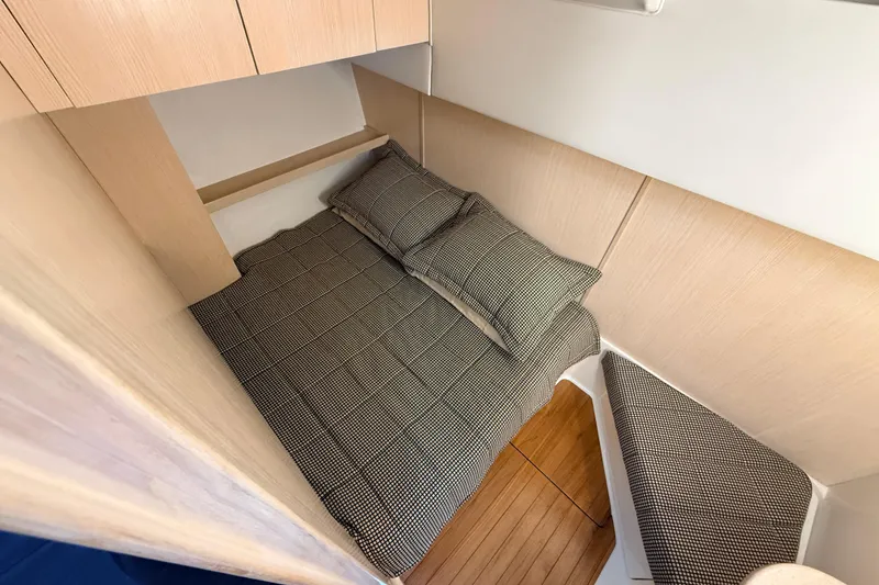 Slide: The Image of 1995 Tiara Yachts 4000 Express cabin with cozy bed and wooden interior. - 48