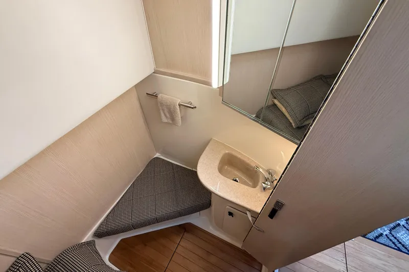Slide: The Image of Bathroom interior of 1995 Tiara Yachts 4000 Express with sink and mirror. - 49
