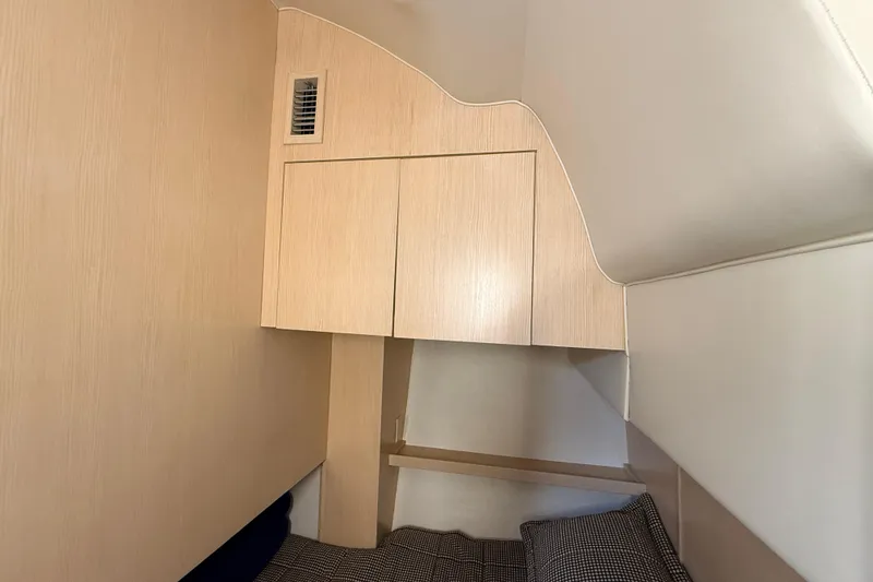 Slide: The Image of Interior cabin of 1995 Tiara Yachts 4000 Express with wooden cabinetry and bedding. - 51
