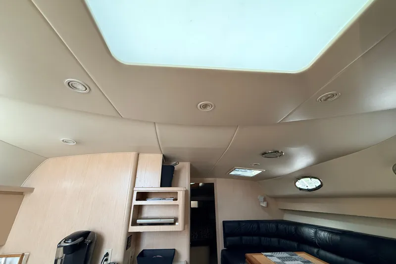 Slide: The Image of Interior of a 1995 Tiara Yachts 4000 Express with modern furnishings and skylight. - 52