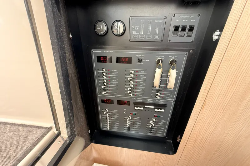 Slide: The Image of Electrical control panel on a 1995 Tiara Yachts 4000 Express boat. - 55