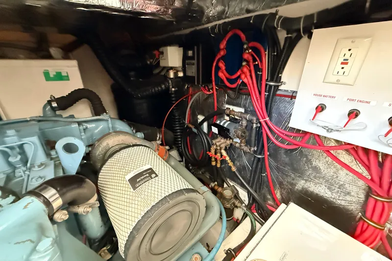 Slide: The Image of Engine room of a 1995 Tiara Yachts 4000 Express, showcasing wiring and components. - 57