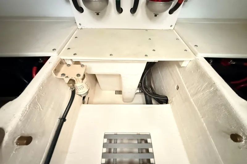 Slide: The Image of Engine compartment of a 1995 Tiara Yachts 4000 Express, showcasing mechanical components. - 60