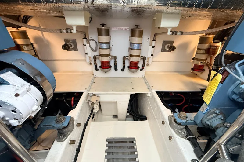 Slide: The Image of Engine room of a 1995 Tiara Yachts 4000 Express, showcasing mechanical components. - 61