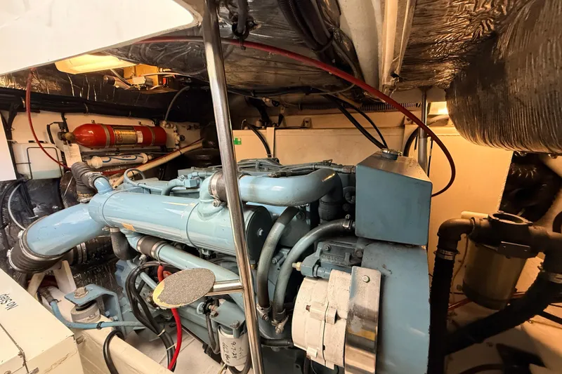 Slide: The Image of Engine room of a 1995 Tiara Yachts 4000 Express, showcasing machinery and components. - 63