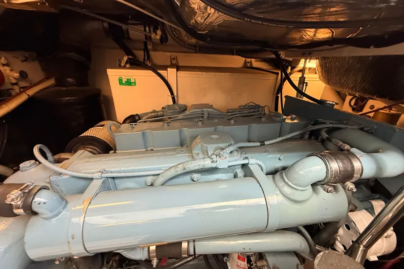 Slide: The Image of Engine compartment of a 1995 Tiara Yachts 4000 Express, showcasing mechanical components. - 64