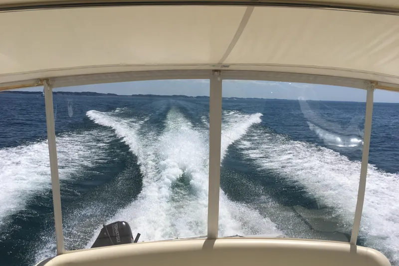 Slide: The Image of View from a 1995 Tiara Yachts 4000 Express, cruising on open water. - 7