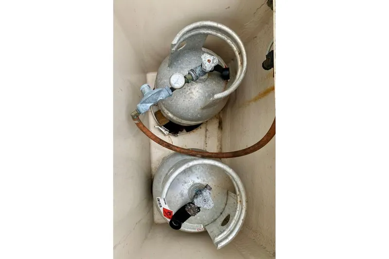 Slide: The Image of Two propane tanks in a storage compartment on a 1997 Hallberg-Rassy 39 yacht. - 12