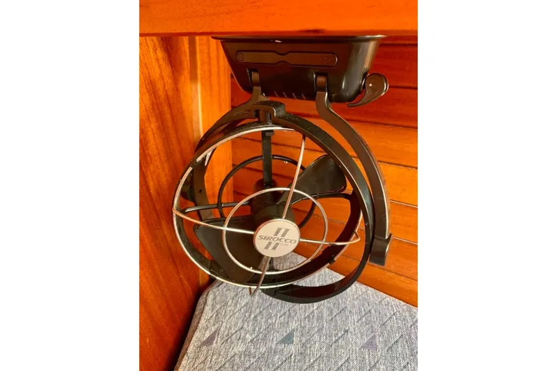 Slide: The Image of Sirocco fan mounted on a 1997 Hallberg-Rassy 39 yacht's wooden interior. - 28