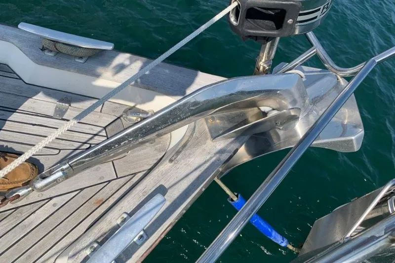 Slide: The Image of Deck view of a 1997 Hallberg-Rassy 39 sailboat with anchor and teak wood finish. - 3