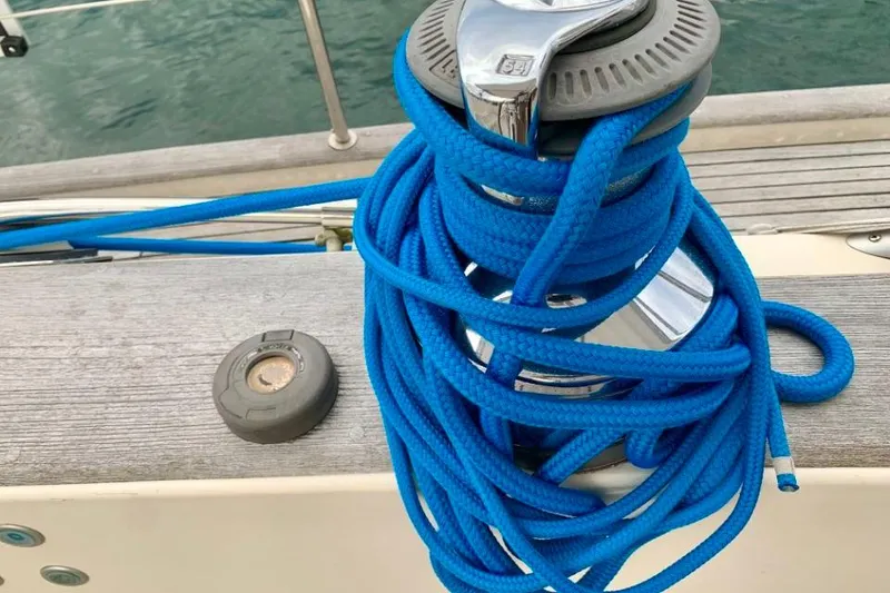 Slide: The Image of Blue rope coiled on a winch aboard a 1997 Hallberg-Rassy 39 sailboat. - 8