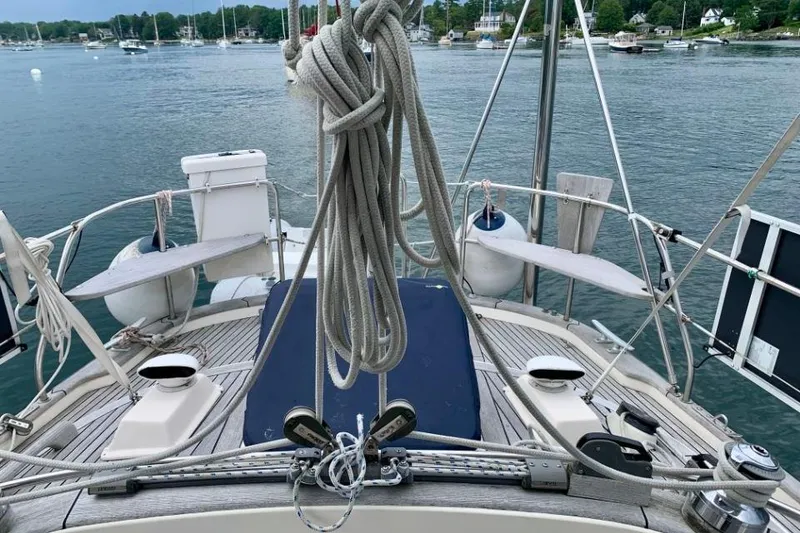 Slide: The Image of Sailboat deck view of 1997 Hallberg-Rassy 39, moored in a serene harbor. - 9