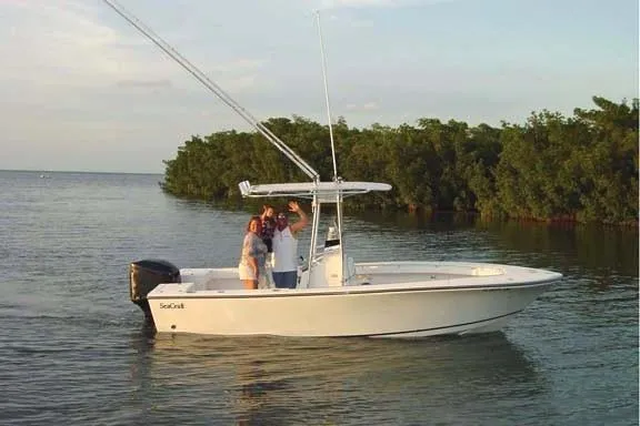 Slide: The Image of 2001 Sea Craft Master Angler 21 boat with people on calm water near mangroves. - 3