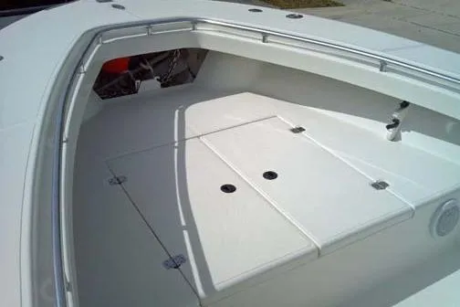 Slide: The Image of 2001 Sea Craft Master Angler 21 boat deck, featuring spacious storage compartments. - 4