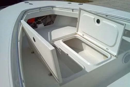 Slide: The Image of 2001 Sea Craft Master Angler 21 boat storage compartments open on deck. - 5