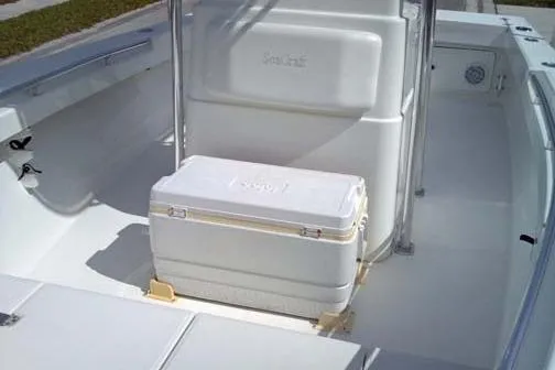 Slide: The Image of 2001 Sea Craft Master Angler 21 boat interior with cooler, showcasing spacious deck design. - 6