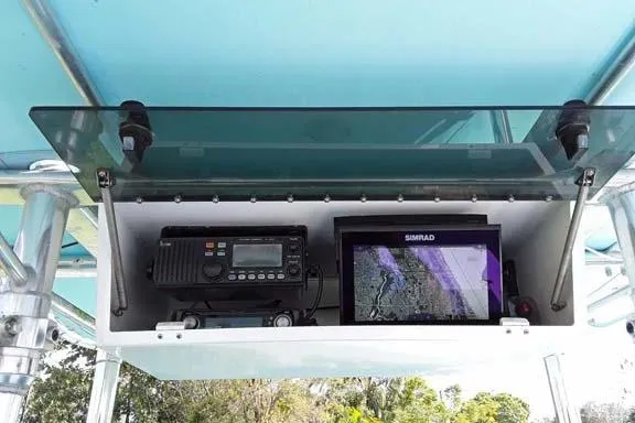 Slide: The Image of 2001 Sea Craft Master Angler 21 electronics compartment with radio and Simrad display. - 7