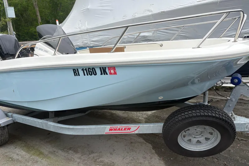 The Image of 2023 Boston Whaler 160 Super Sport boat on trailer, side view. - 0
