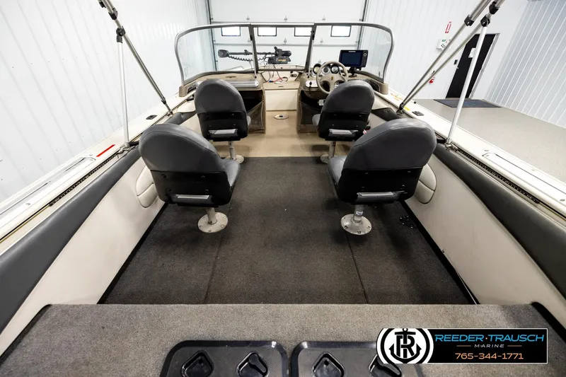 Slide: The Image of Interior view of 2004 Crestliner 2050 Sportfish boat with seating and steering console. - 12