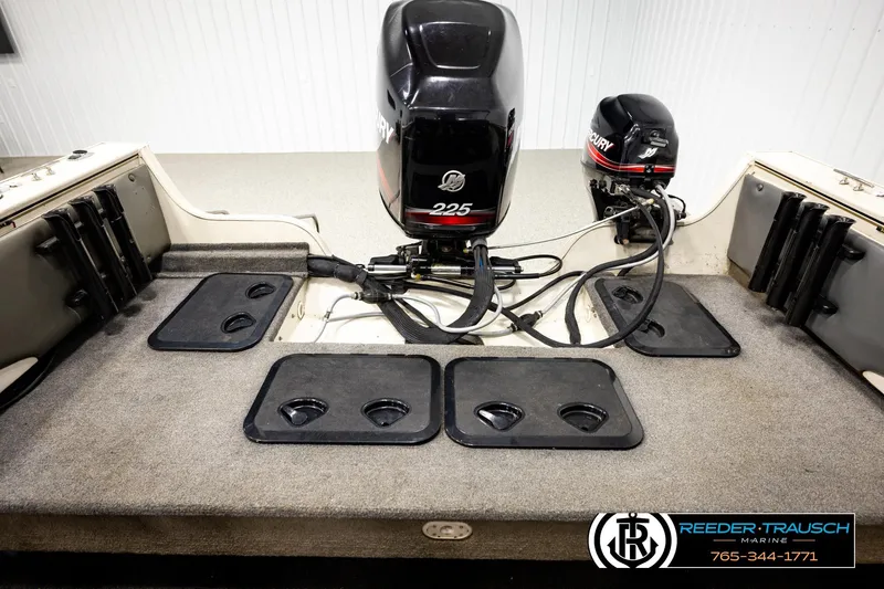 Slide: The Image of 2004 Crestliner 2050 Sportfish boat with dual Mercury outboard motors in a showroom. - 17