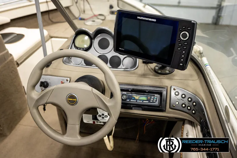 Slide: The Image of Steering console of a 2004 Crestliner 2050 Sportfish with Humminbird Helix 9 display. - 26
