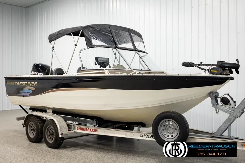 Slide: The Image of 2004 Crestliner 2050 Sportfish boat on trailer in indoor storage facility. - 3