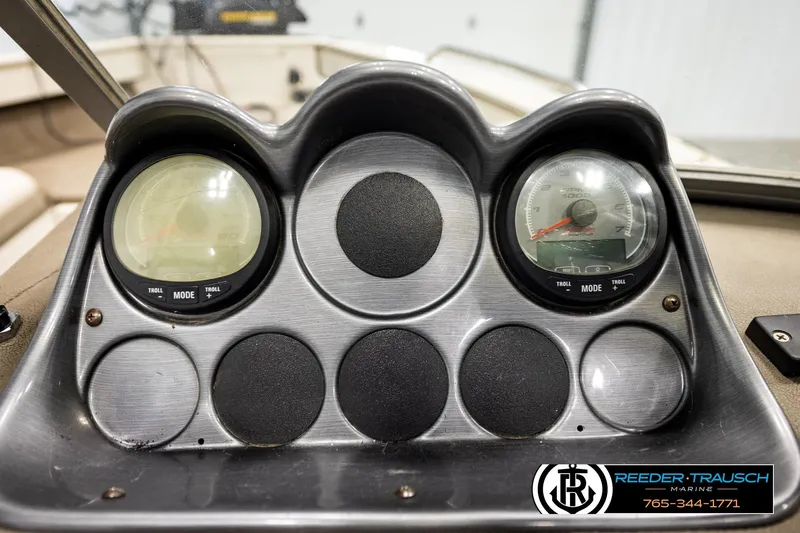 Slide: The Image of Dashboard of a 2004 Crestliner 2050 Sportfish boat with gauges and controls. - 30