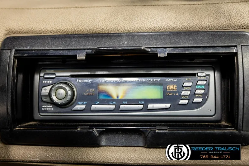 Slide: The Image of 2004 Crestliner 2050 Sportfish boat stereo system, featuring a Seaworthy CD player. - 32