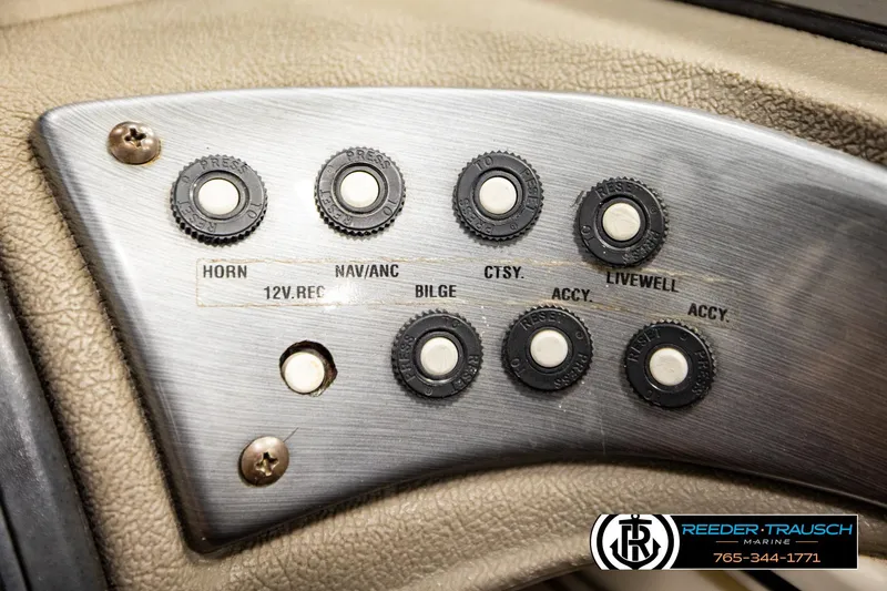 Slide: The Image of Control panel of a 2004 Crestliner 2050 Sportfish boat with labeled switches. - 33