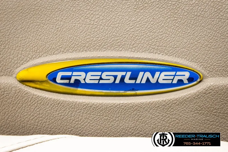 Slide: The Image of Crestliner 2050 Sportfish 2004 logo on beige textured surface, Reeder-Trausch Marine branding. - 40