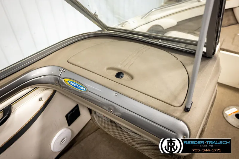 Slide: The Image of 2004 Crestliner 2050 Sportfish boat interior with dashboard and windshield details. - 42