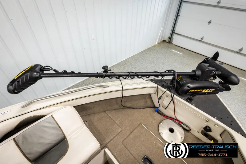 Slide: The Image of 2004 Crestliner 2050 Sportfish boat with Minn Kota trolling motor in a garage setting. - 45
